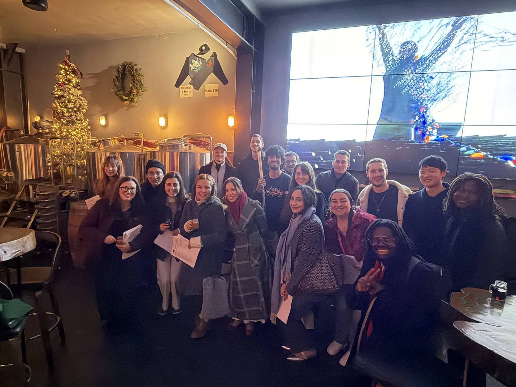 During Advent in 2025, we went Christmas caroling around the Richmond neighborhood, first visiting the houses of fellow Star parishioners, and then going to bars on Clement Street. This picture was taken at Lost Marbles, where we got a round of free drinks